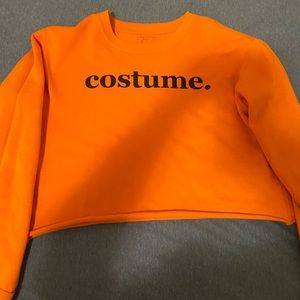 This is an orange cropped top